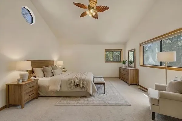 a view of an empty room with a ceiling fan