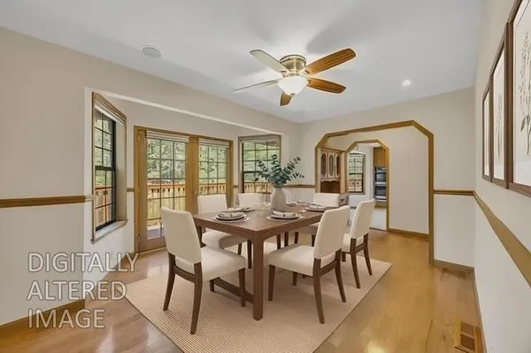 a view of a dining room with furniture window and wooden floor