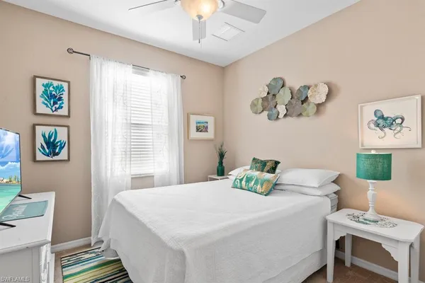 a bedroom with a bed and a desk
