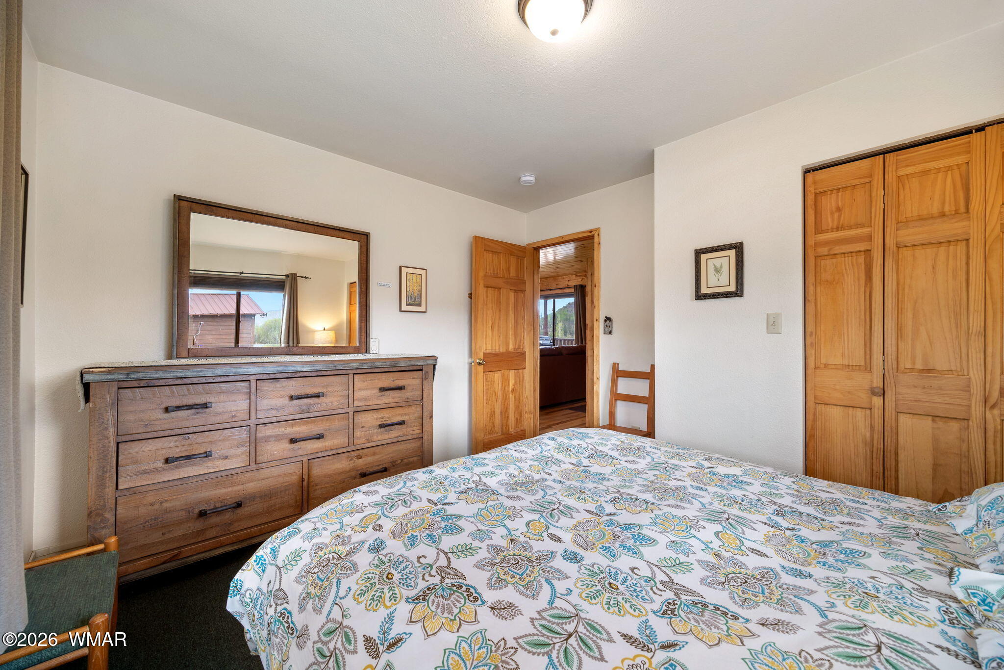 85 Main Street Greer, AZ 85927 - Photo 38 of 55 a bedroom with a bed and a dresser