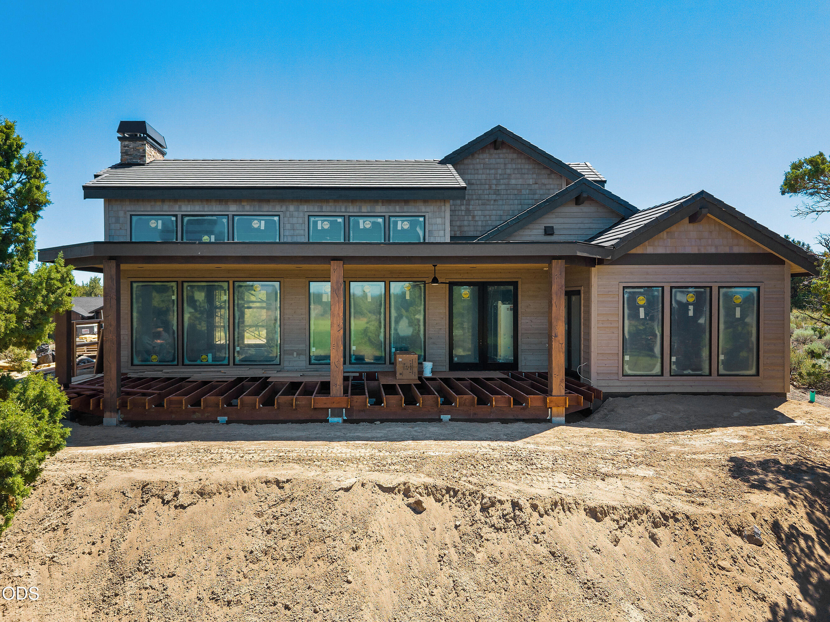22936 Ghost Tree Lane Bend, OR 97701 - Photo 13 of 45 a front view of a house with a yard and seating space
