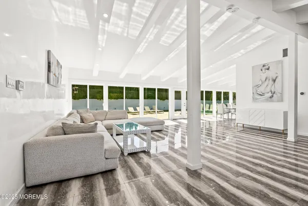 a living room with furniture and white walls