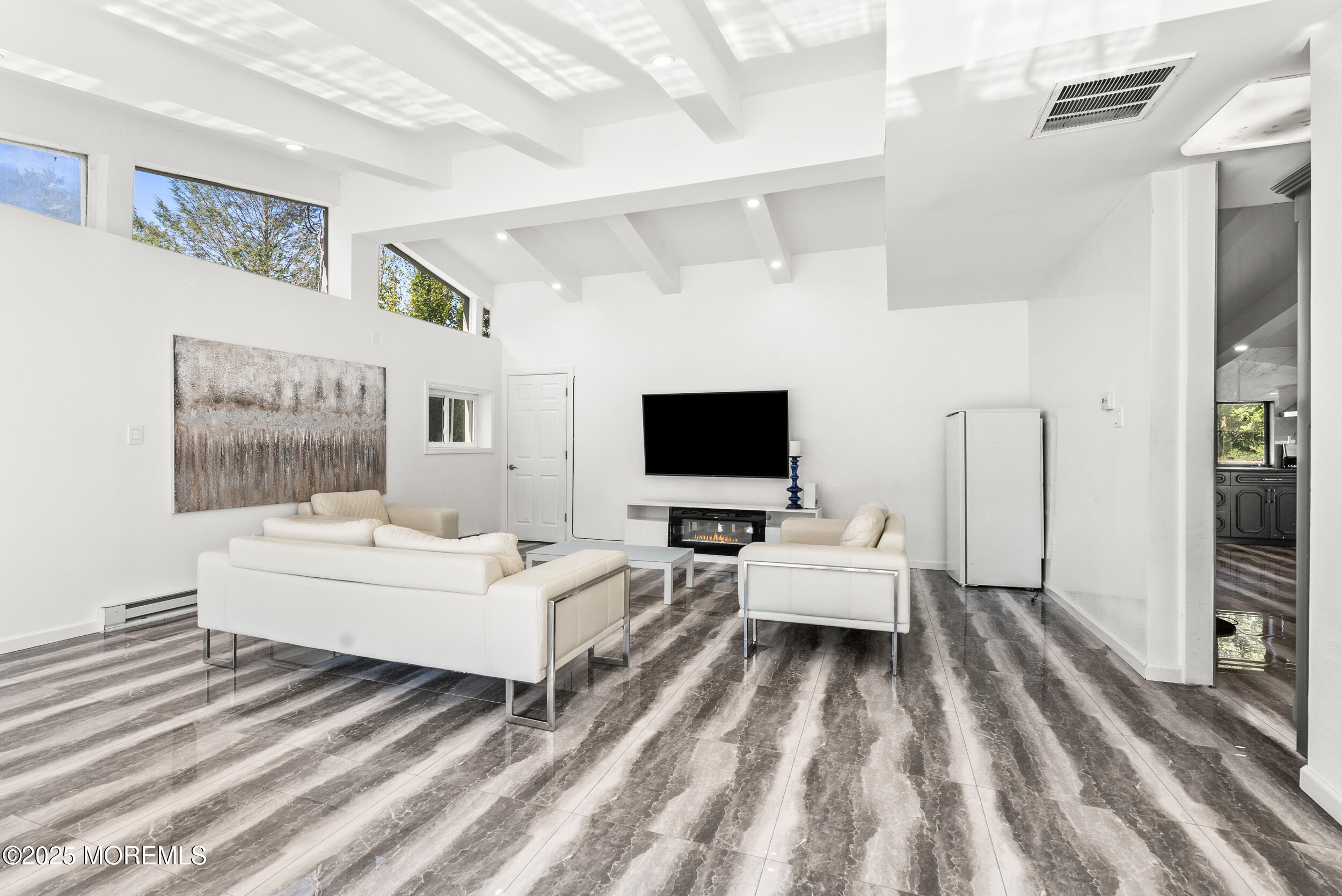 512 Deal Road Asbury Park, NJ 07712 - Photo 16 of 40 a living room with furniture and a flat screen tv