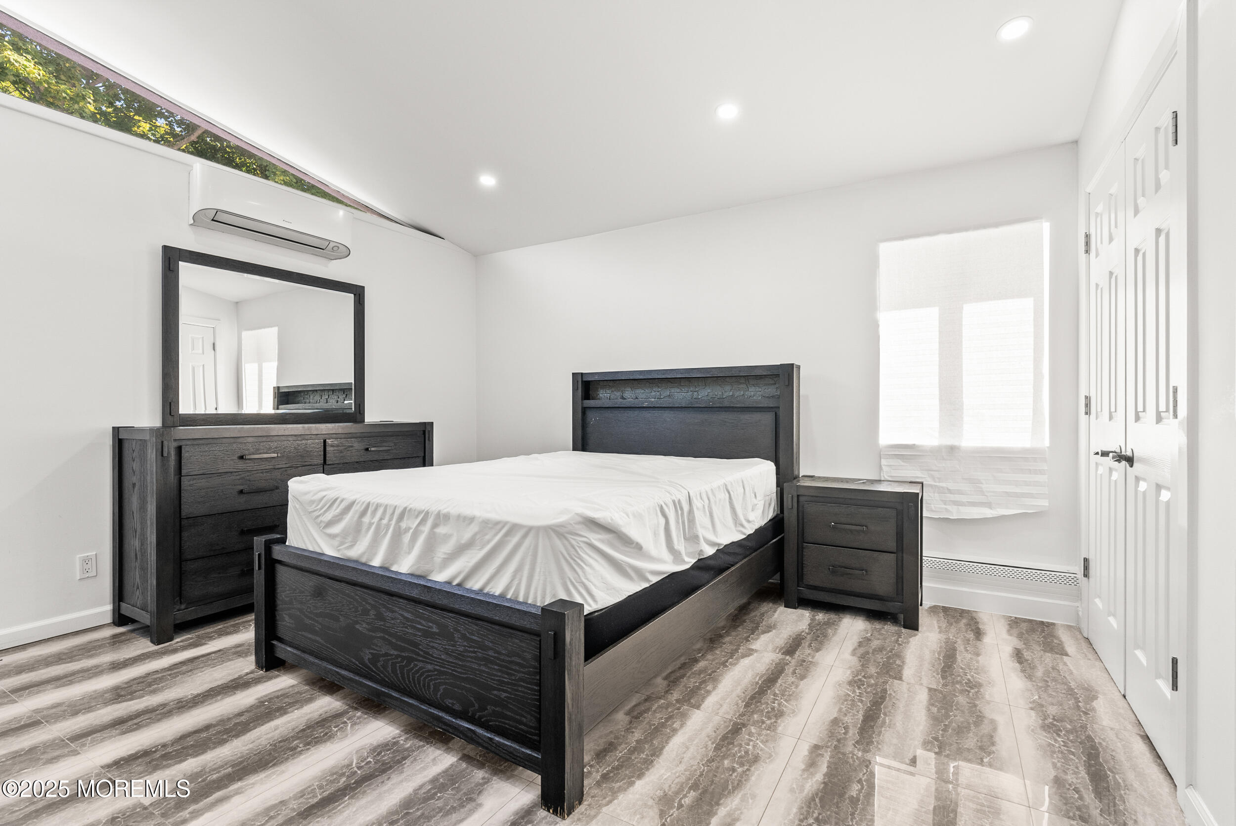 512 Deal Road Asbury Park, NJ 07712 - Photo 18 of 40 a bedroom with a bed and a dresser