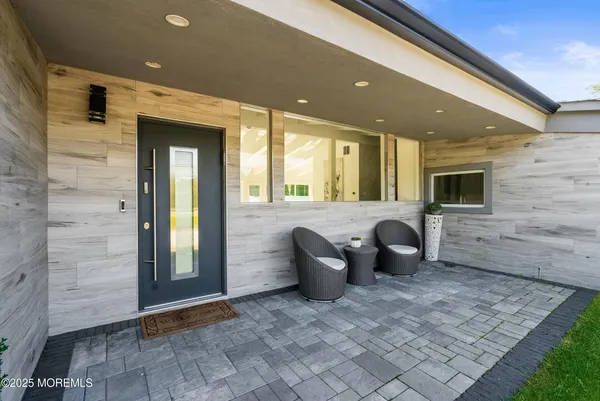 a view of a hallway with seating area