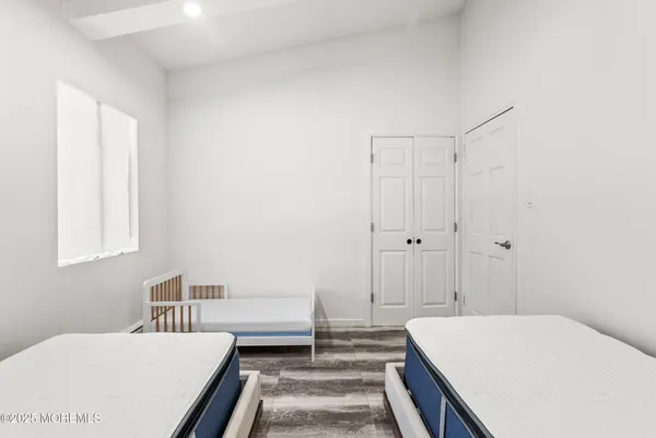 a bedroom with a bed and a table