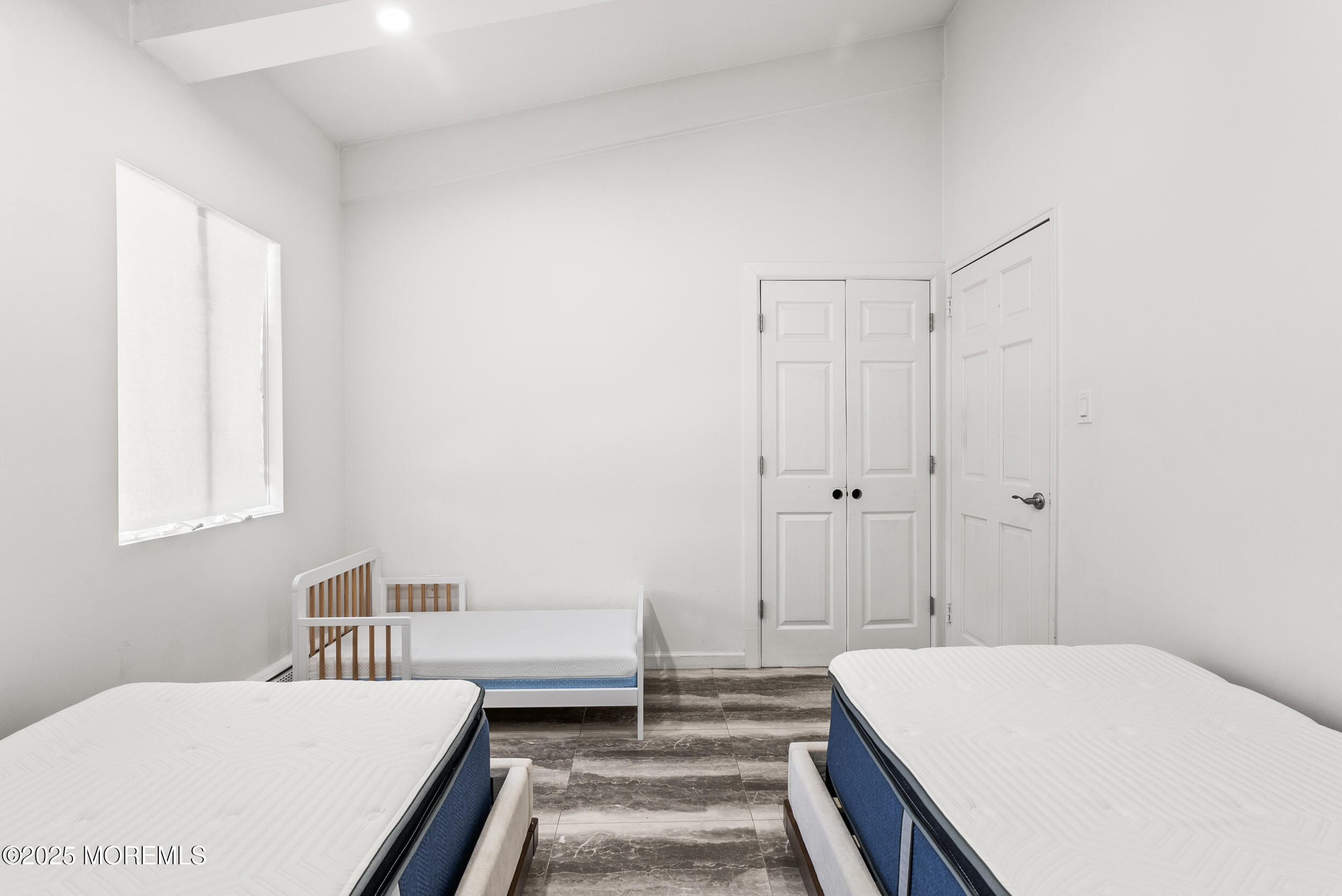 512 Deal Road Asbury Park, NJ 07712 - Photo 23 of 40 a bedroom with a bed and a table