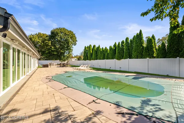 a view of a pool with a yard