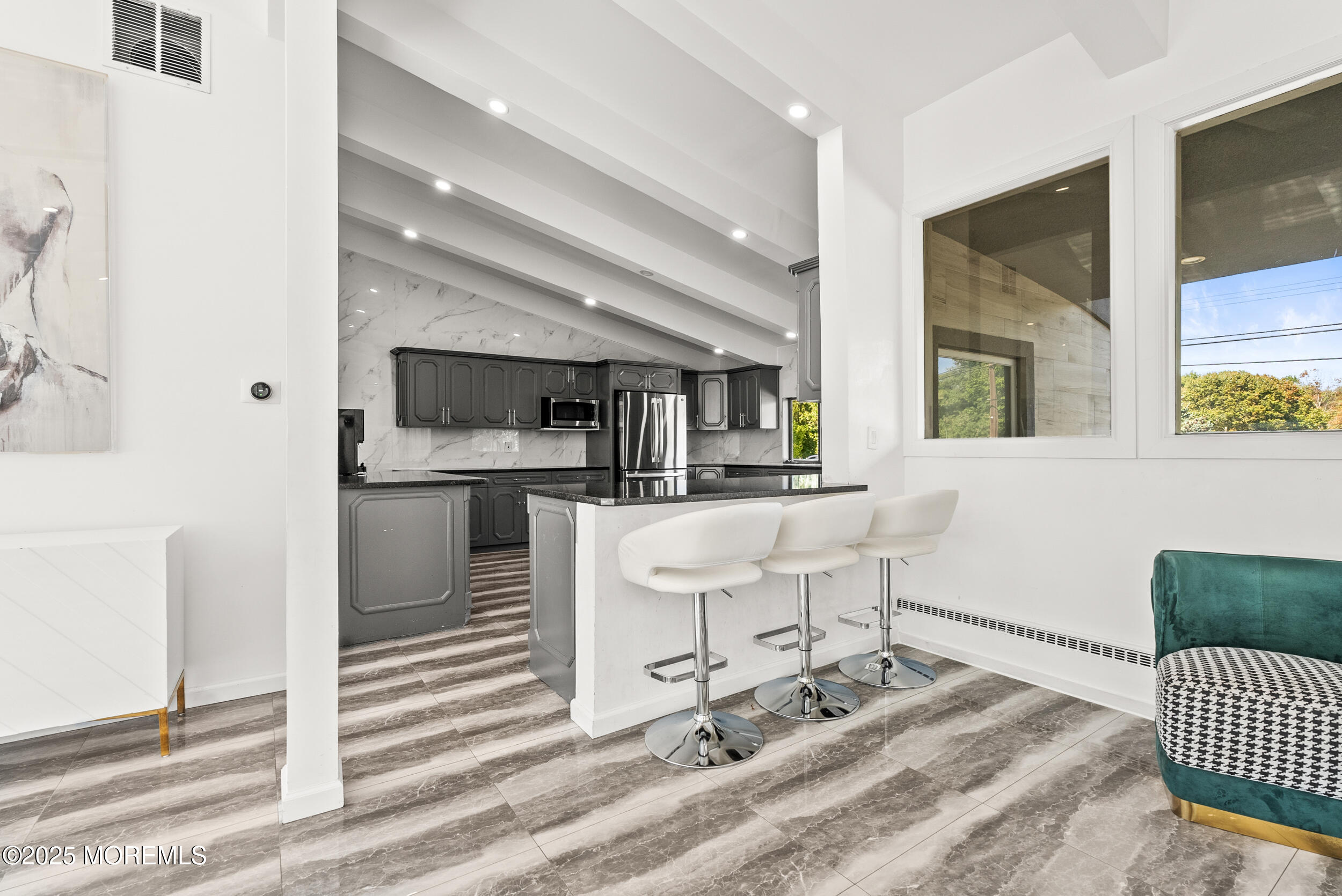 512 Deal Road Asbury Park, NJ 07712 - Photo 5 of 40 a living room with a sink and a dining table with outer view