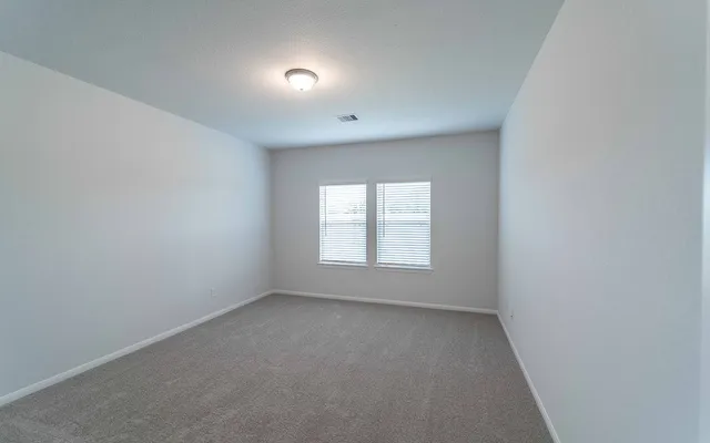 a bathroom with a sink double vanity and a mirror