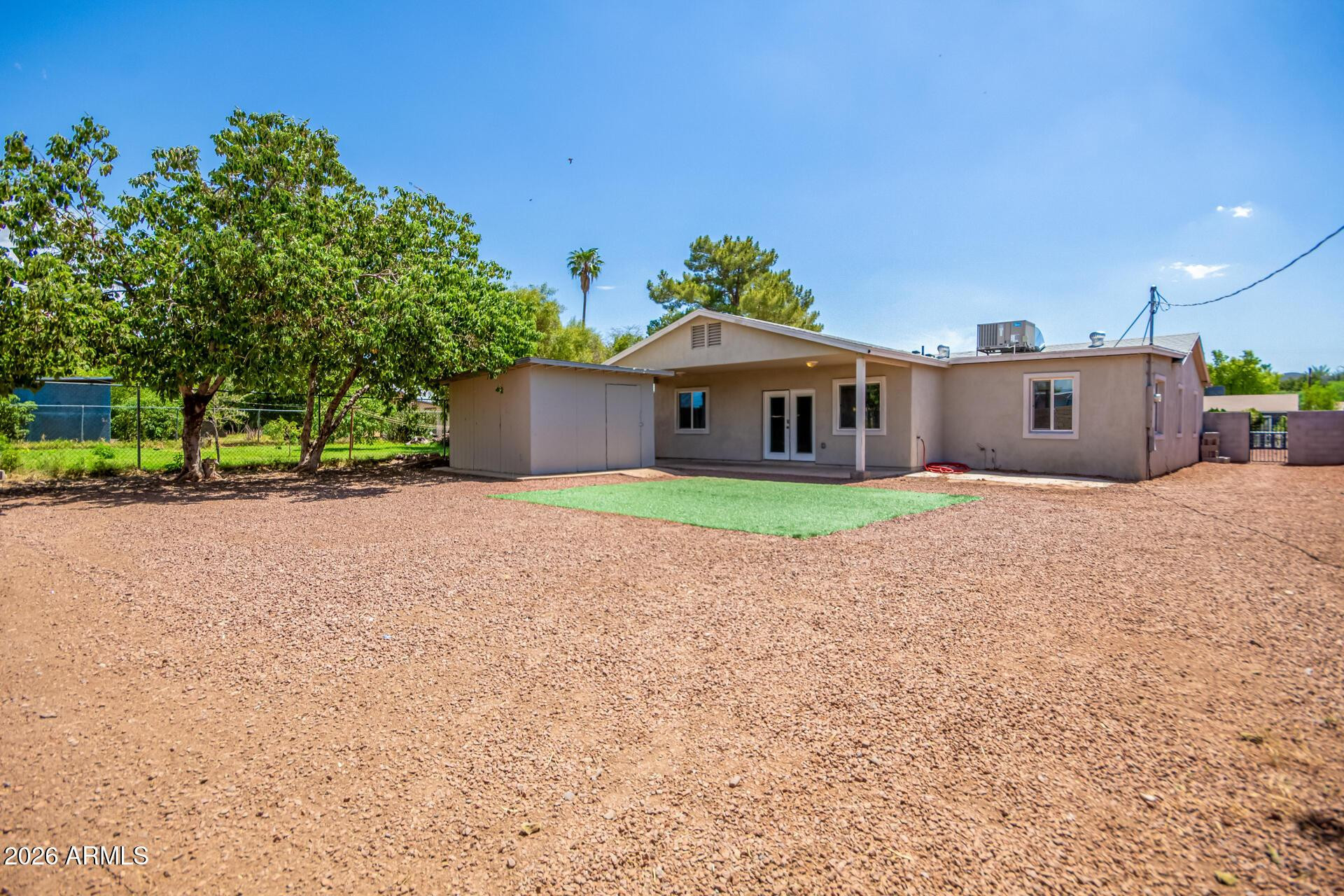 1636 East Whitton Avenue Phoenix, AZ 85016 - Photo 15 of 15 a house with trees in the background