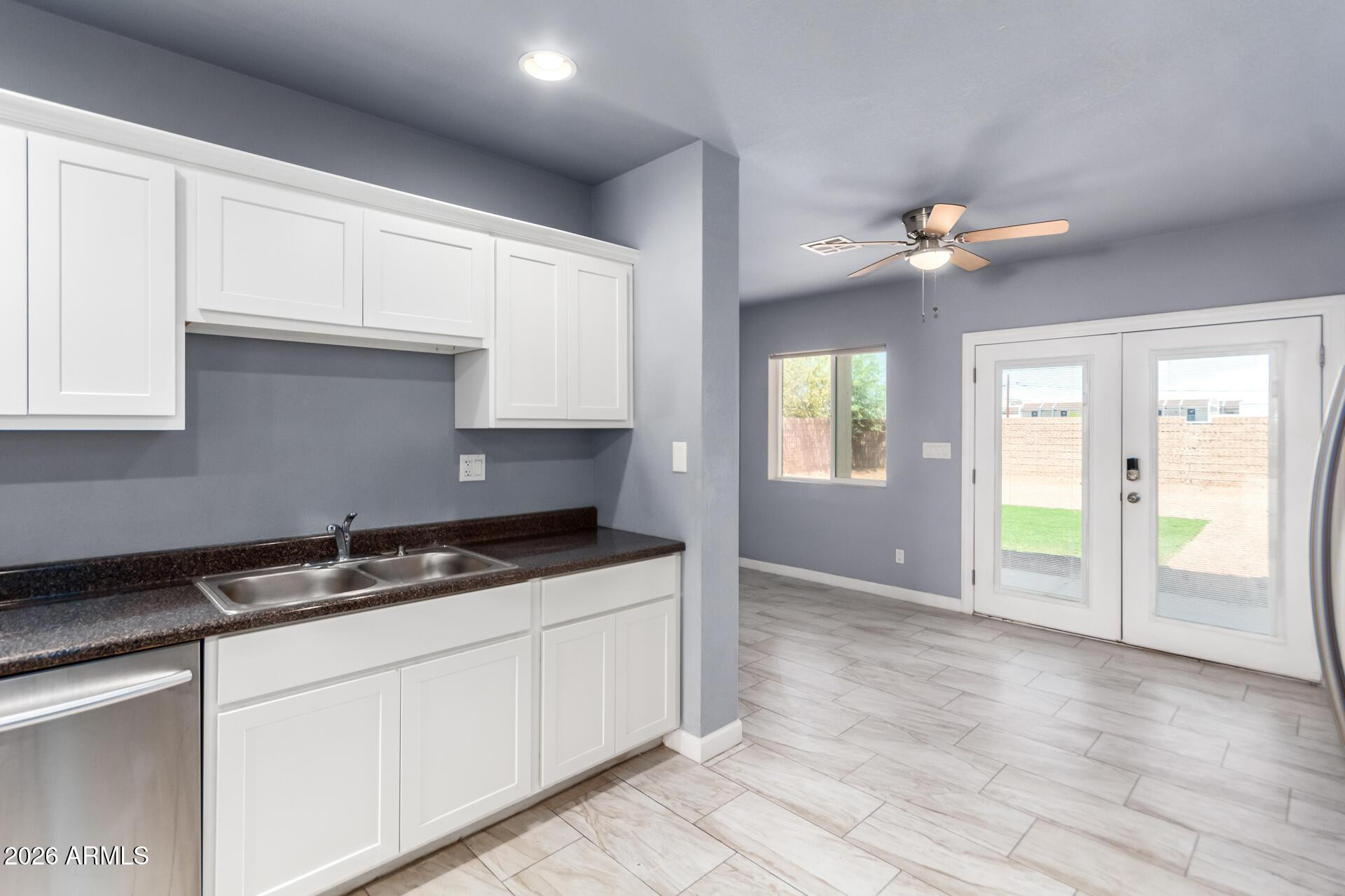 1636 East Whitton Avenue Phoenix, AZ 85016 - Photo 3 of 15 a kitchen that has a lot of cabinets in it with granite countertop stainless steel appliances