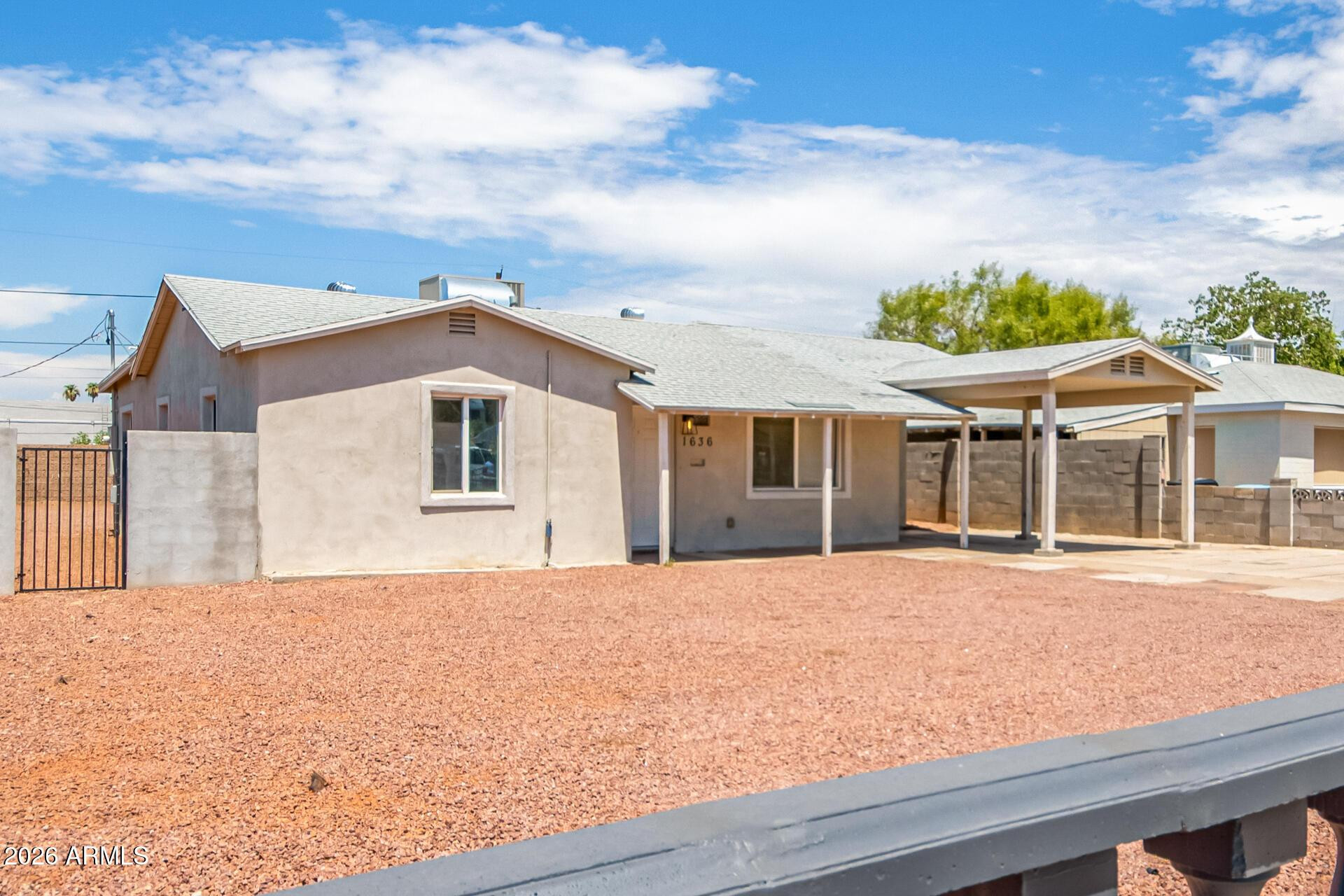 1636 East Whitton Avenue Phoenix, AZ 85016 - Photo 4 of 15 a front view of a house with a garden