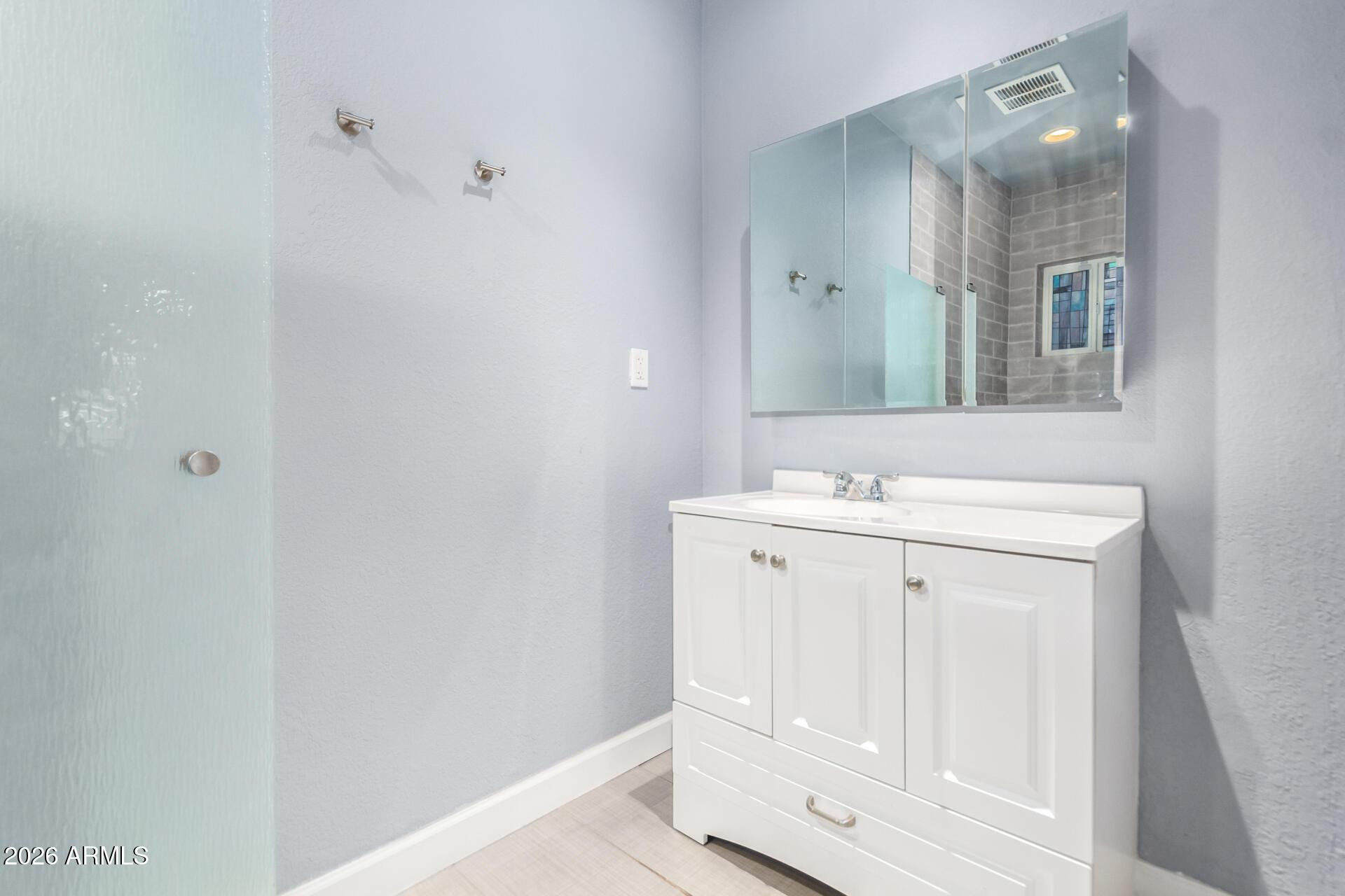 1636 East Whitton Avenue Phoenix, AZ 85016 - Photo 6 of 15 a bathroom with a sink vanity and a mirror