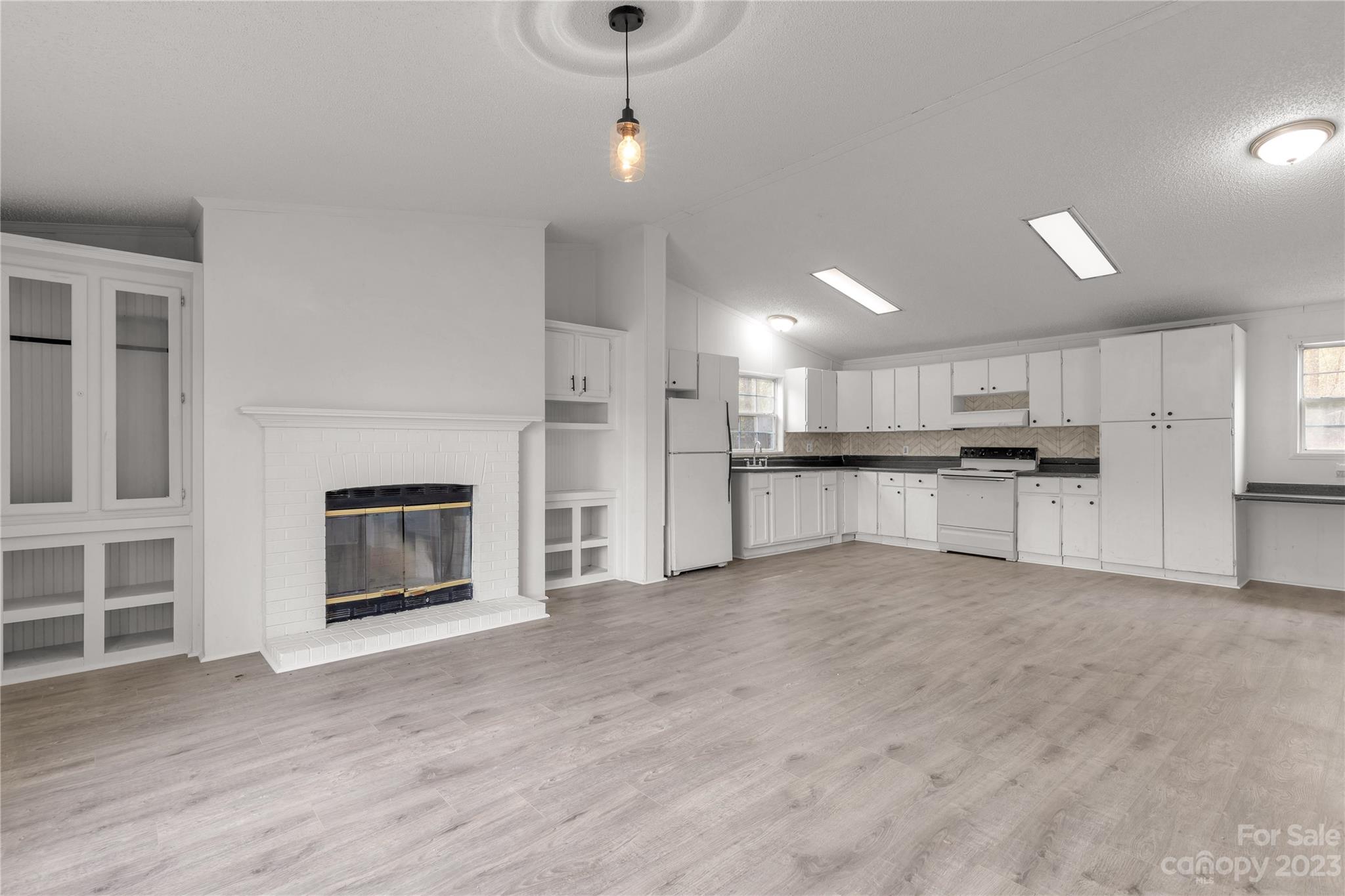3678 Old Camden Road Heath Springs, SC 29058 - Photo 11 of 34 a view of a kitchen with a sink and a stove top oven