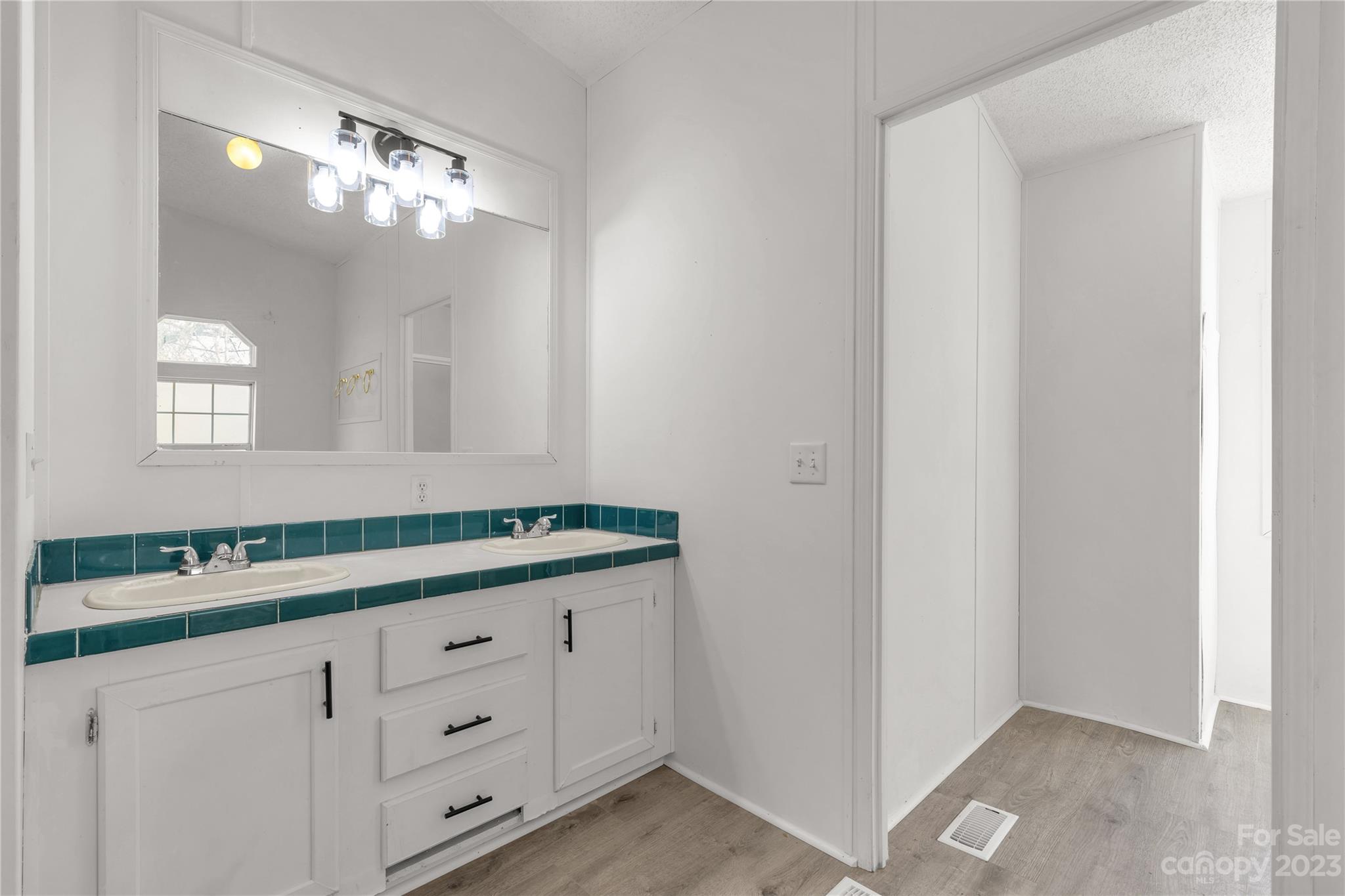 3678 Old Camden Road Heath Springs, SC 29058 - Photo 20 of 34 a bathroom with a sink and a mirror