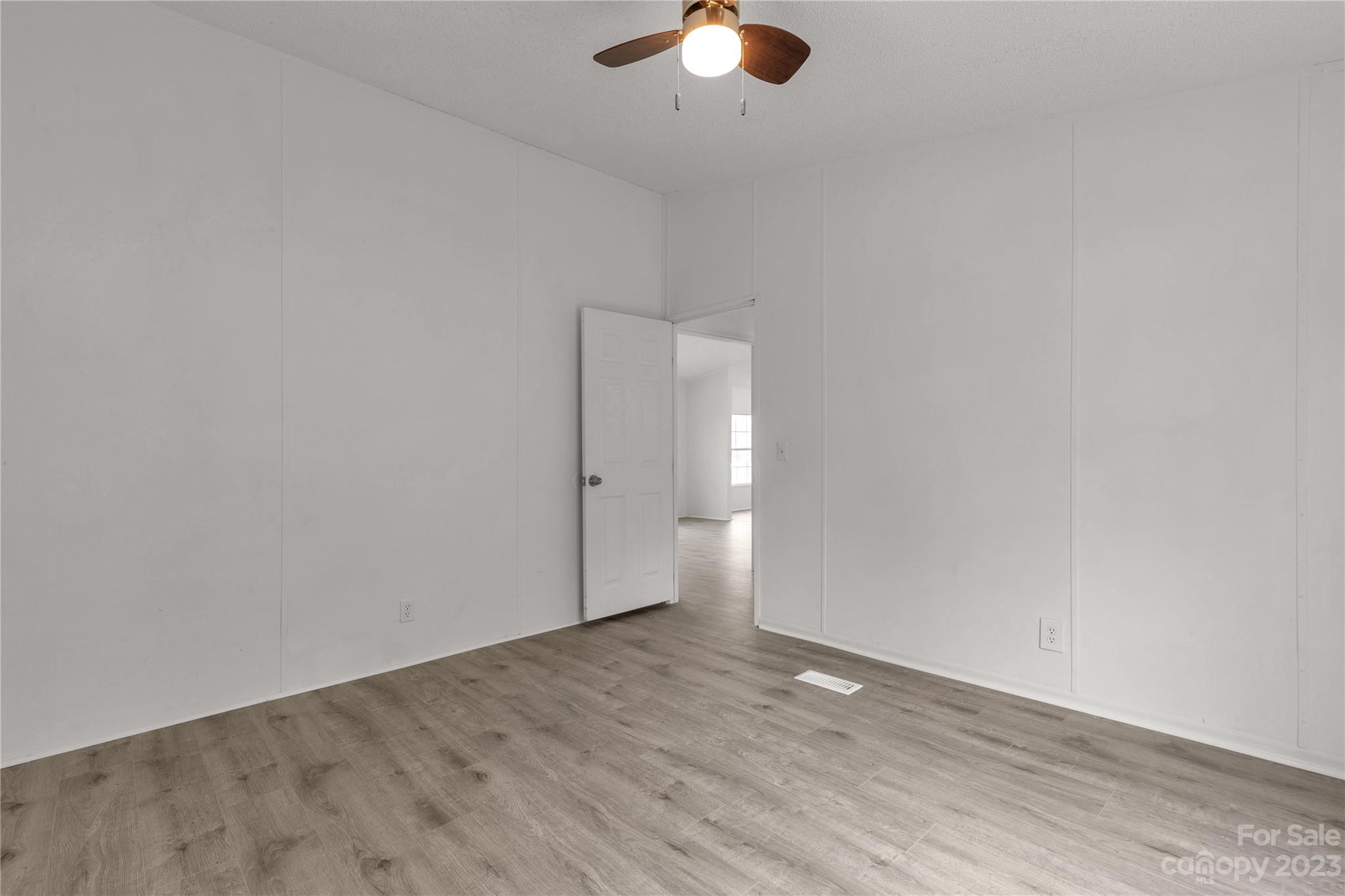 3678 Old Camden Road Heath Springs, SC 29058 - Photo 23 of 34 a view of an empty room with wooden floor
