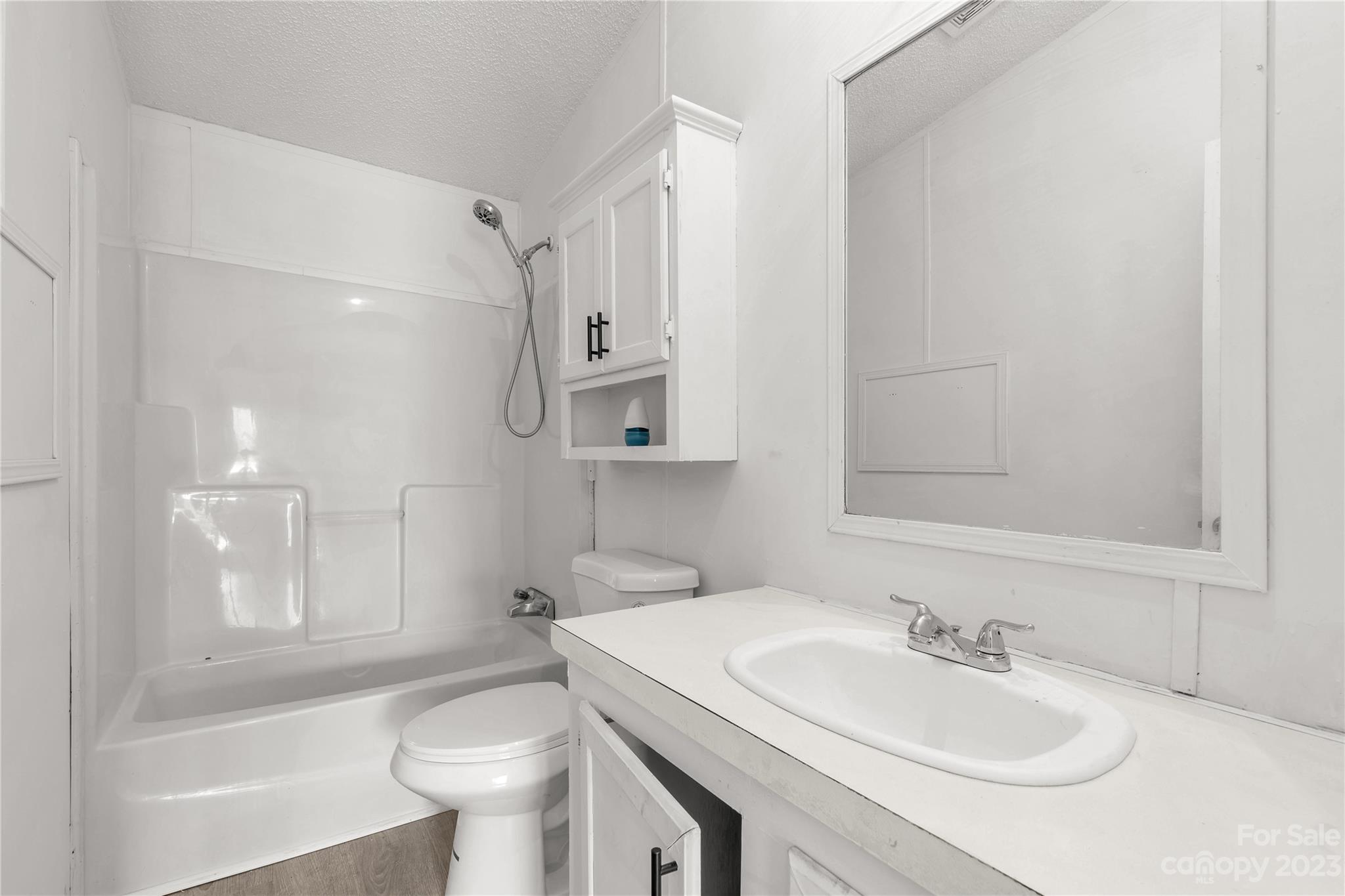 3678 Old Camden Road Heath Springs, SC 29058 - Photo 24 of 34 a bathroom with a sink toilet vanity and shower