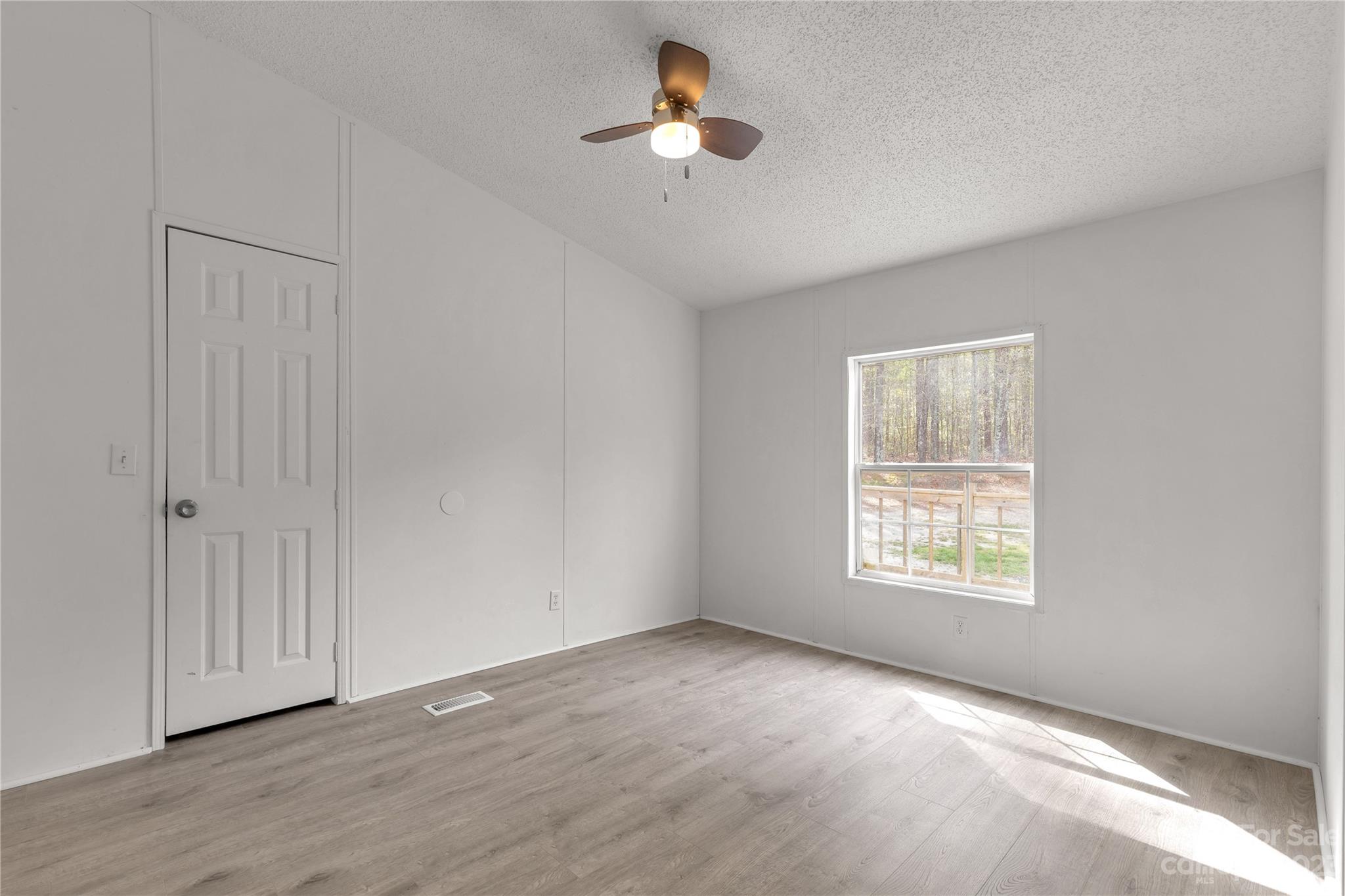 3678 Old Camden Road Heath Springs, SC 29058 - Photo 25 of 34 a view of an empty room with a window