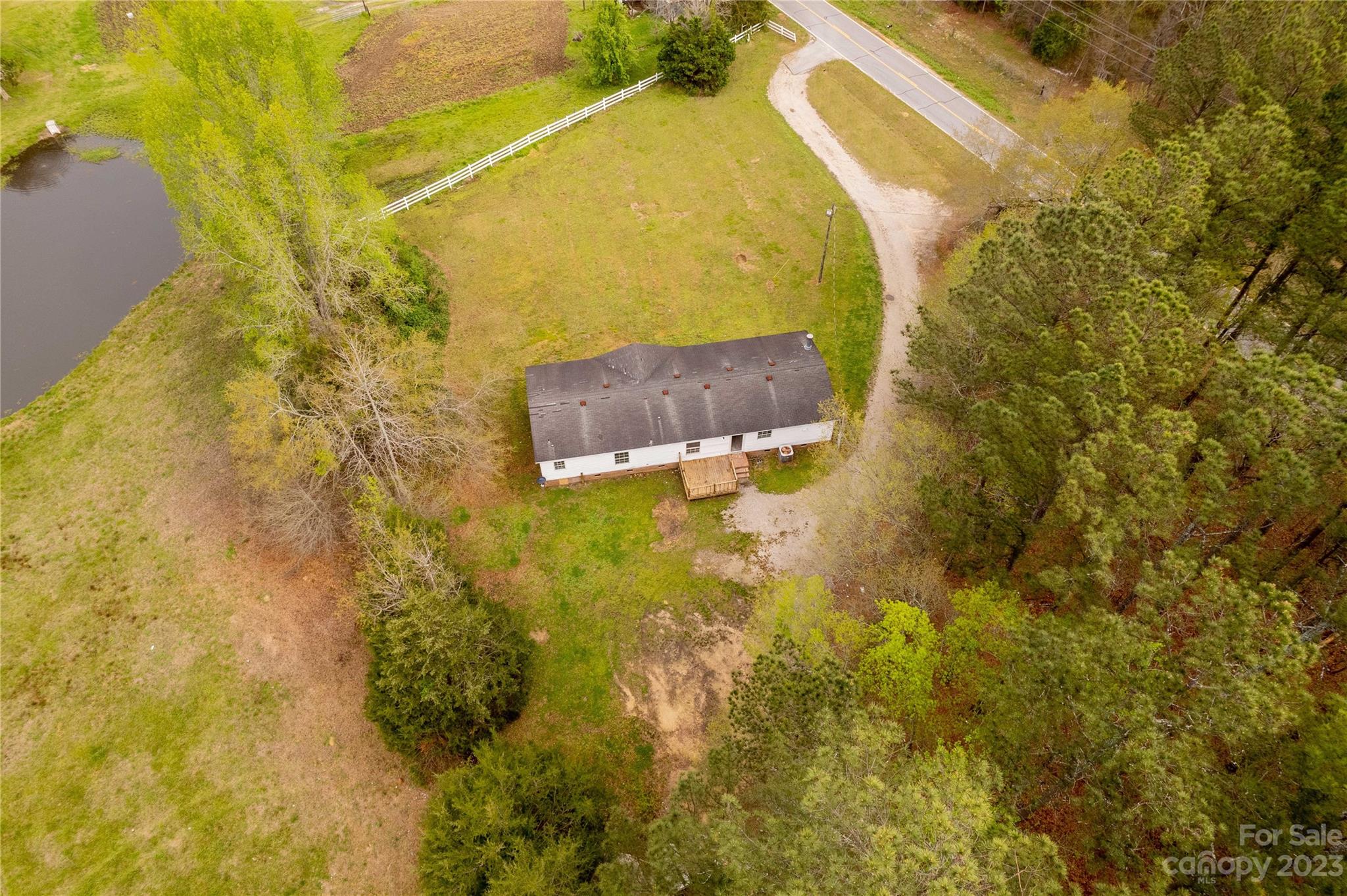 3678 Old Camden Road Heath Springs, SC 29058 - Photo 30 of 34 a building with a yard