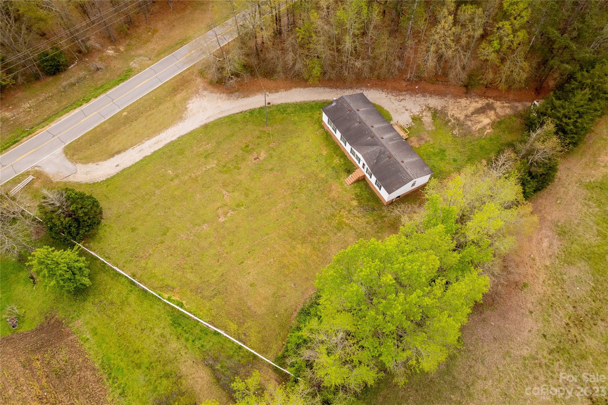3678 Old Camden Road Heath Springs, SC 29058 - Photo 31 of 34 a view of a swimming pool and an outdoor space