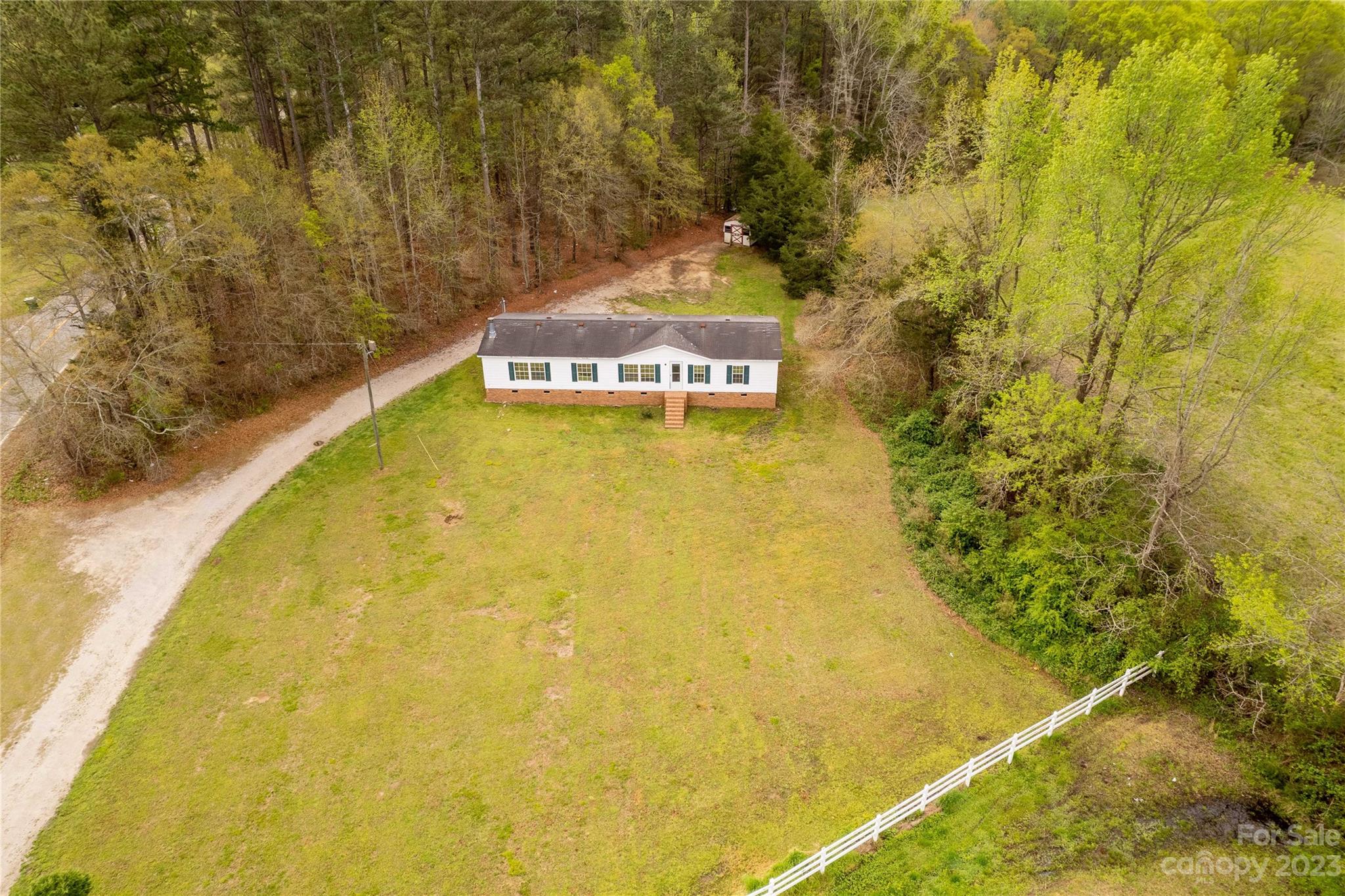 3678 Old Camden Road Heath Springs, SC 29058 - Photo 33 of 34 a view of a swimming pool with an outdoor space and seating area