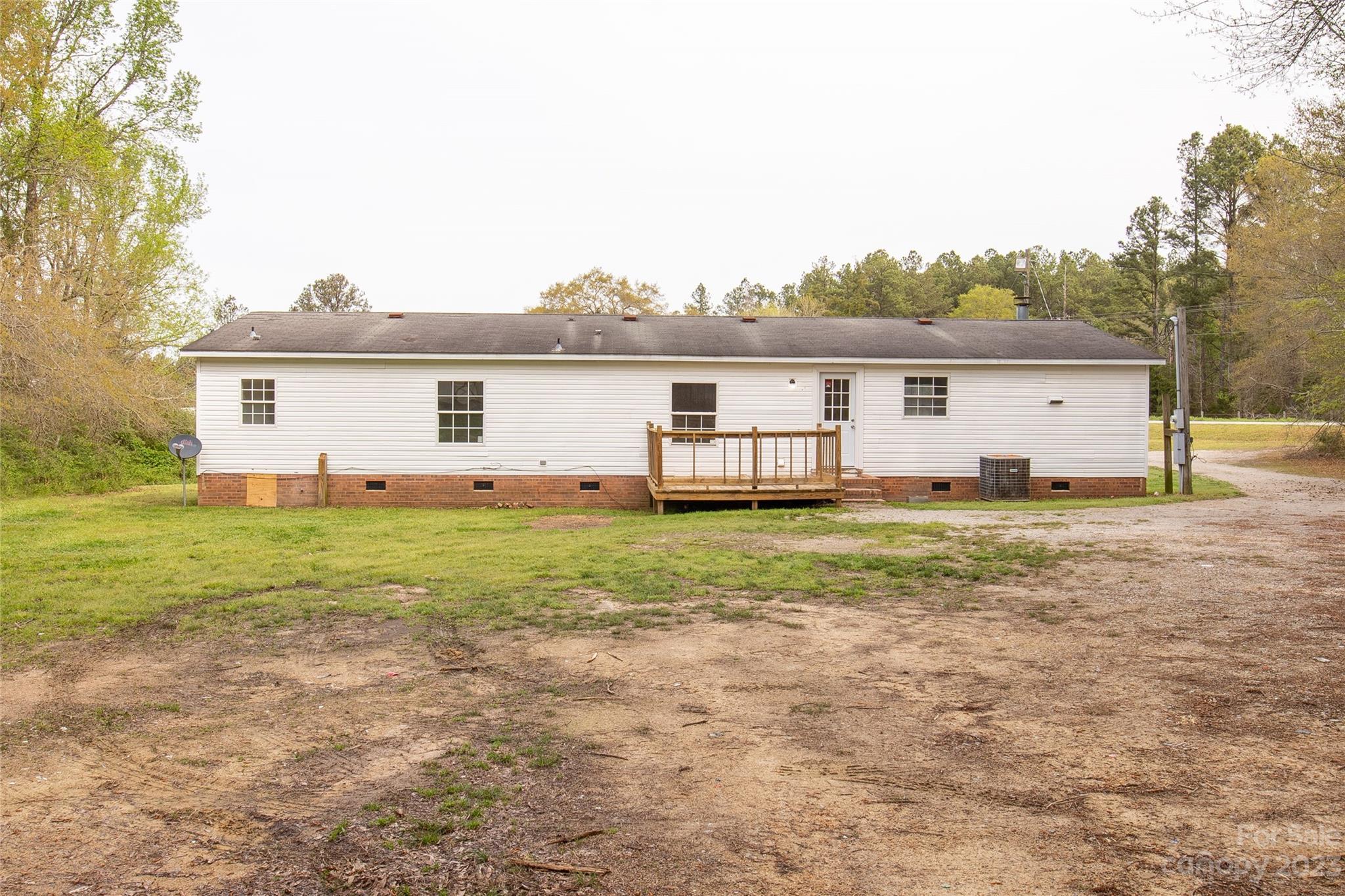 3678 Old Camden Road Heath Springs, SC 29058 - Photo 5 of 34 a view of a house with backyard and garden