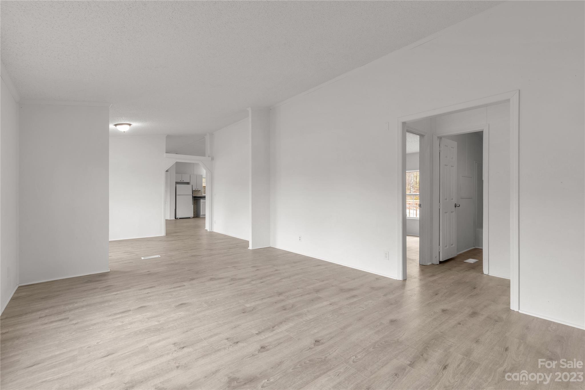 3678 Old Camden Road Heath Springs, SC 29058 - Photo 7 of 34 a view of an empty room and wooden floor