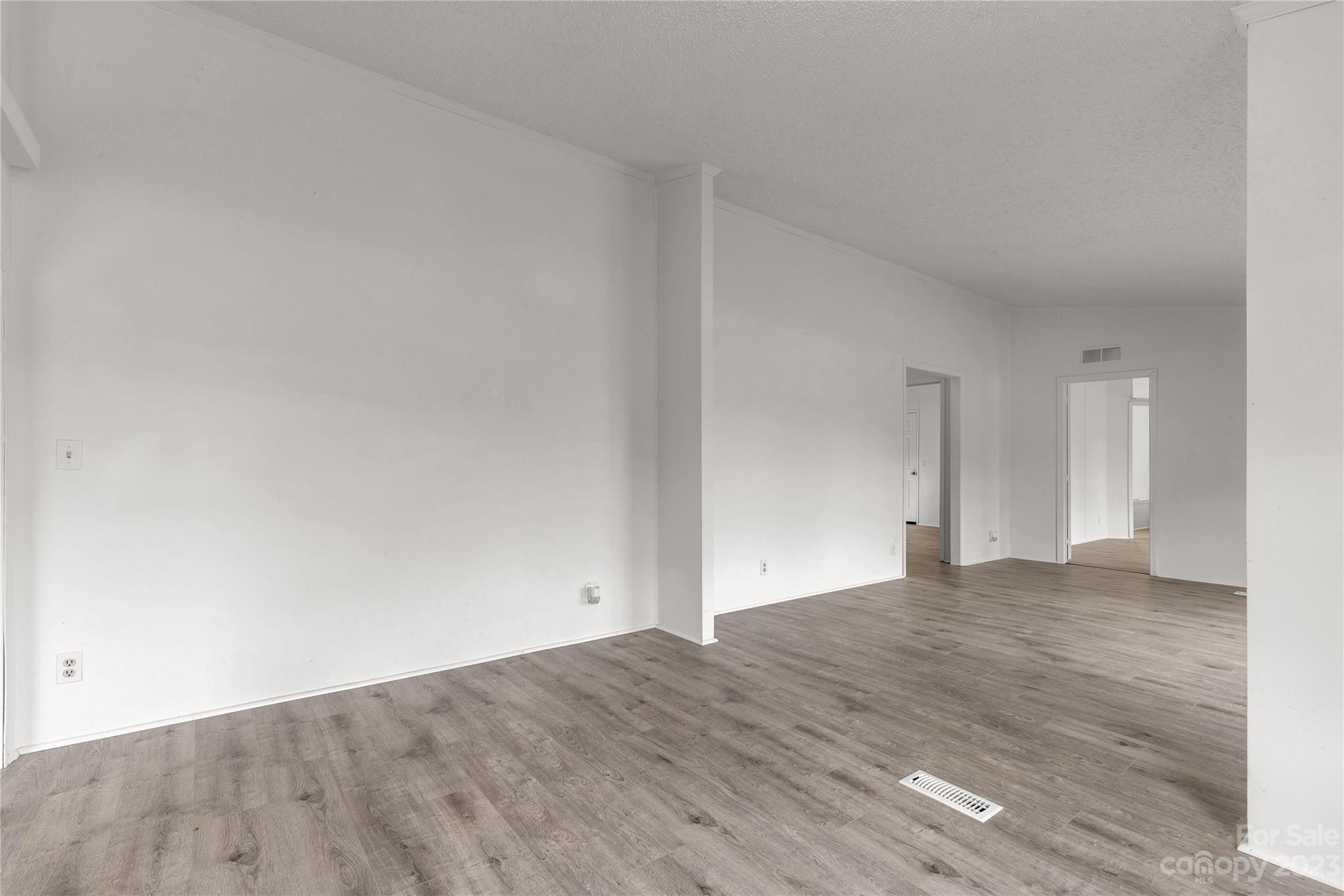 3678 Old Camden Road Heath Springs, SC 29058 - Photo 10 of 34 a view of an empty room and wooden floor