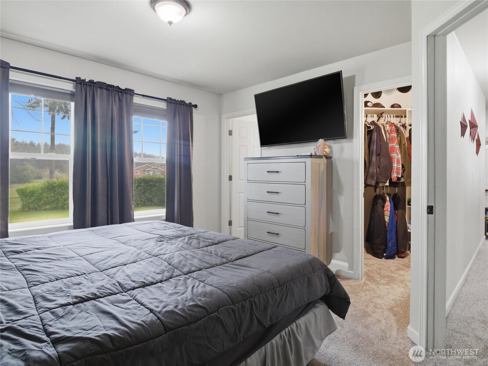 115 Romerman Road Chehalis, WA 98532 - Photo 12 of 40 a bedroom with a bed and a flat screen tv