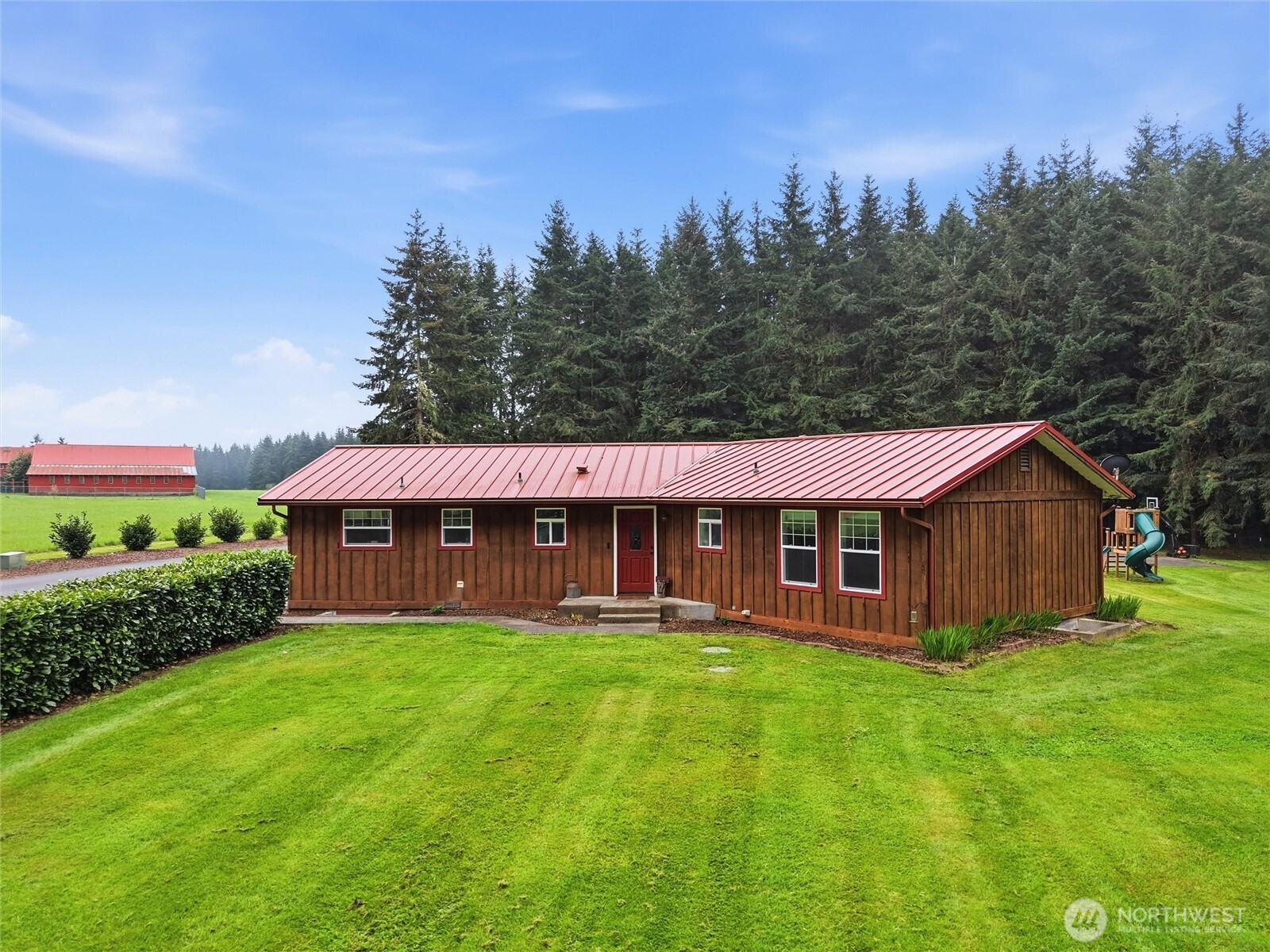 115 Romerman Road Chehalis, WA 98532 - Photo 2 of 40 a view of a house with a big yard and large trees