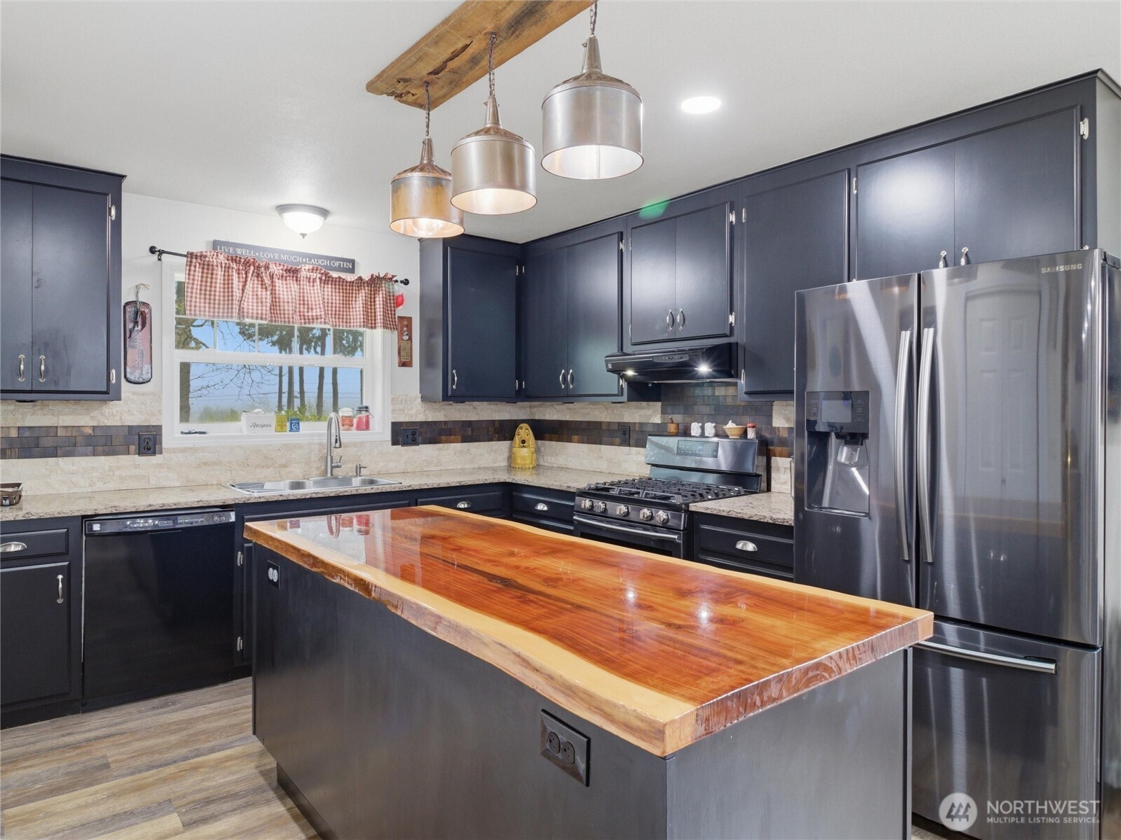 115 Romerman Road Chehalis, WA 98532 - Photo 9 of 40 a kitchen with stainless steel appliances granite countertop a sink a stove and a refrigerator