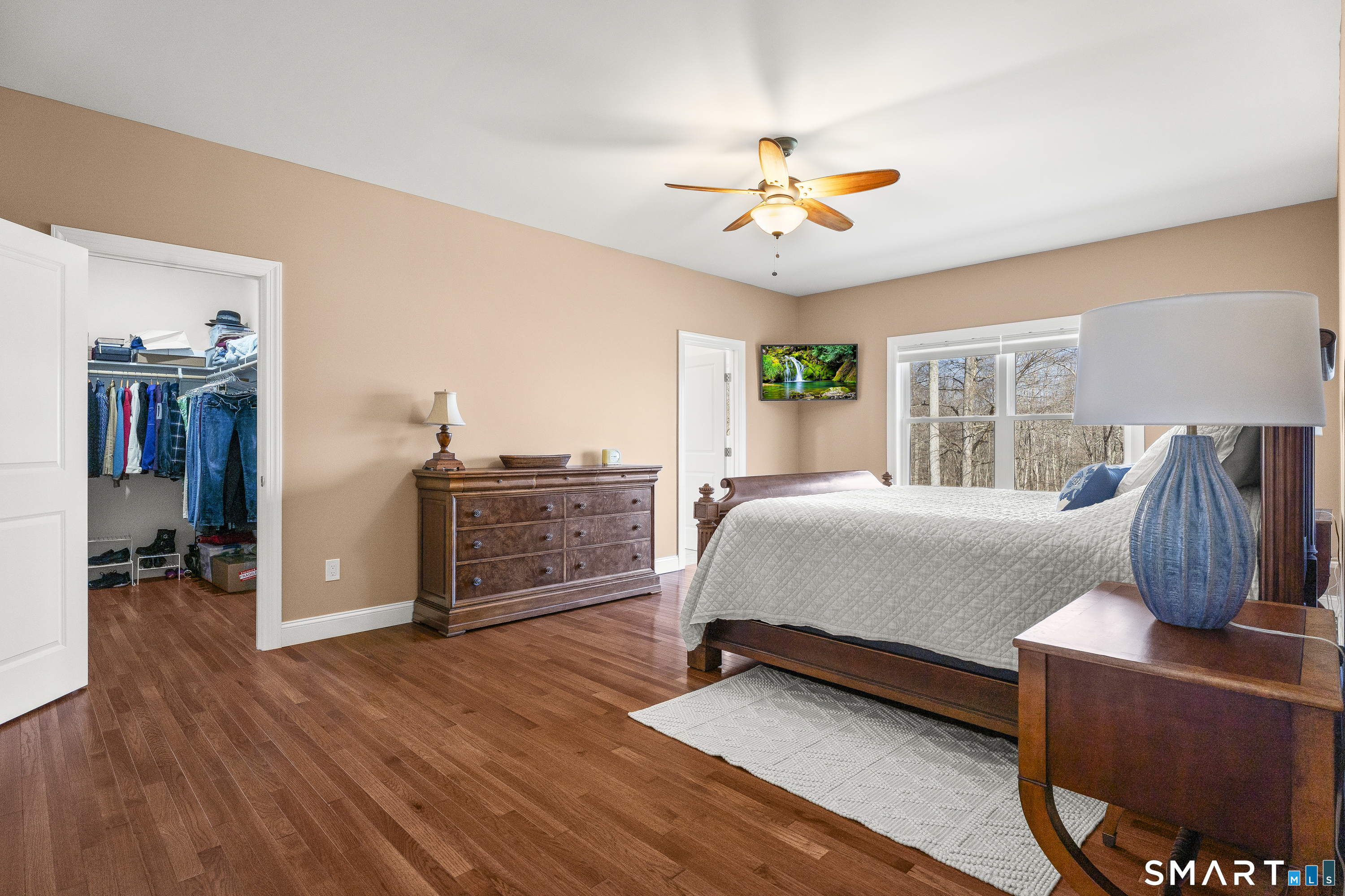 6 Syleo Lane Salem, CT 06420 - Photo 16 of 38 a bedroom with furniture and wooden floor