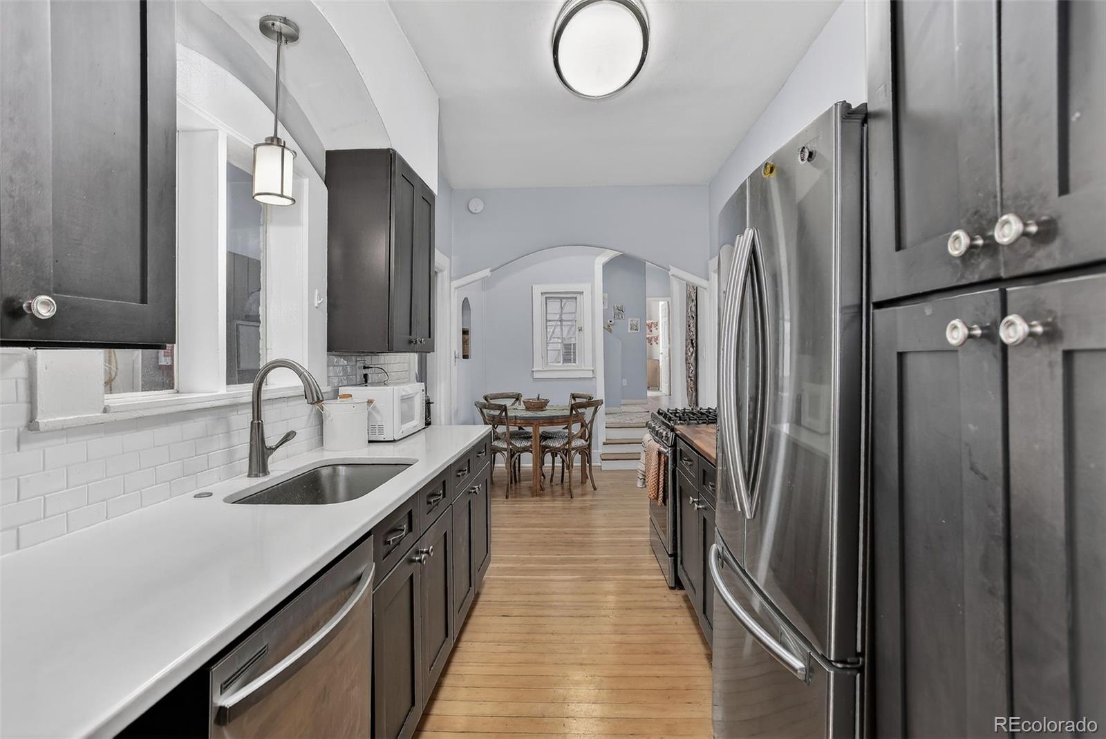 1902 Grove Street Boulder, CO 80302 - Photo 2 of 38 a kitchen with refrigerator cabinets and a sink
