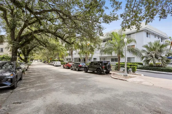 a view of a street with cars