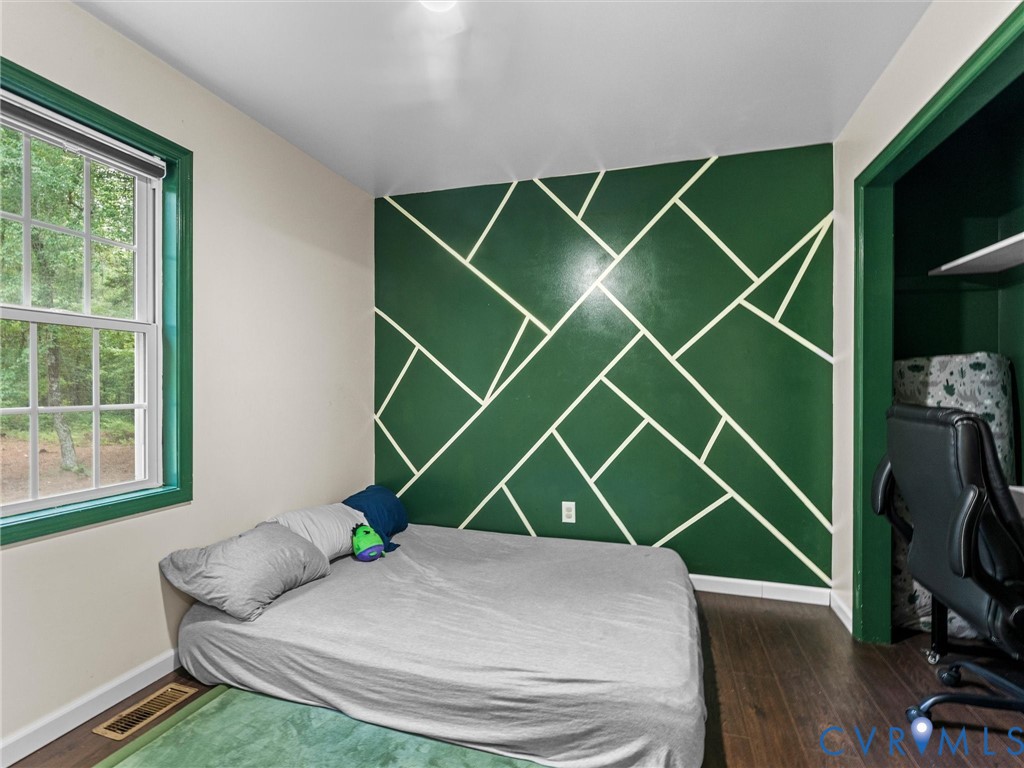 14175 Lebanon Road Disputanta, VA 23842 - Photo 35 of 60 Accent wall with geometric design, wood-finish flo