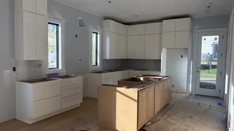 a kitchen with stainless steel appliances granite countertop a stove and a refrigerator
