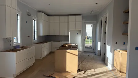 a kitchen with stainless steel appliances granite countertop a refrigerator and a stove