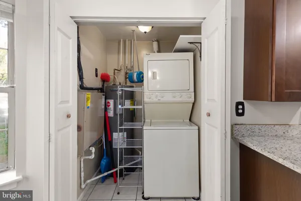 a view of storage and utility room with washer and dryer