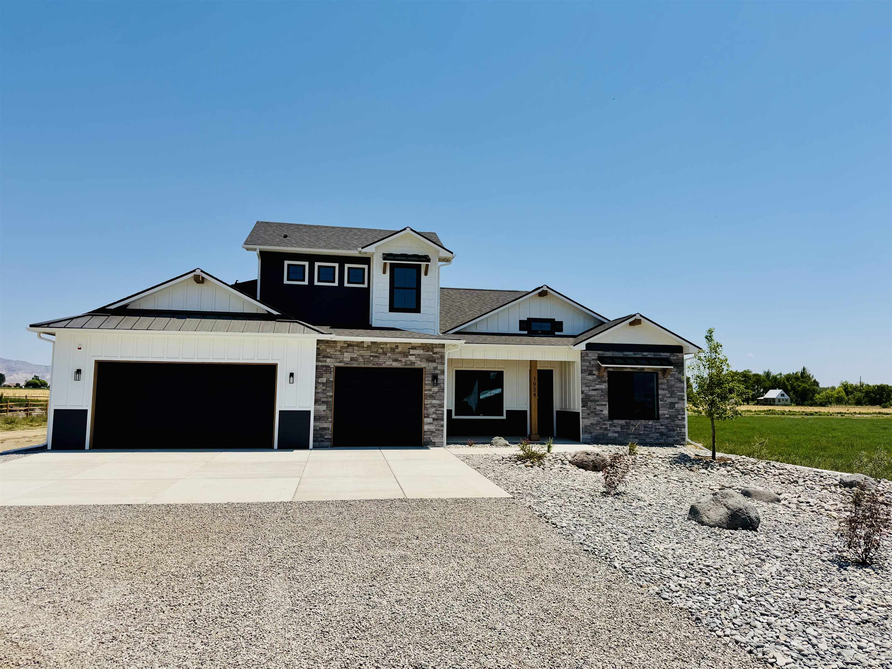 1924 K Road Fruita, CO 81521 - Photo 2 of 40 a front view of a house with a yard