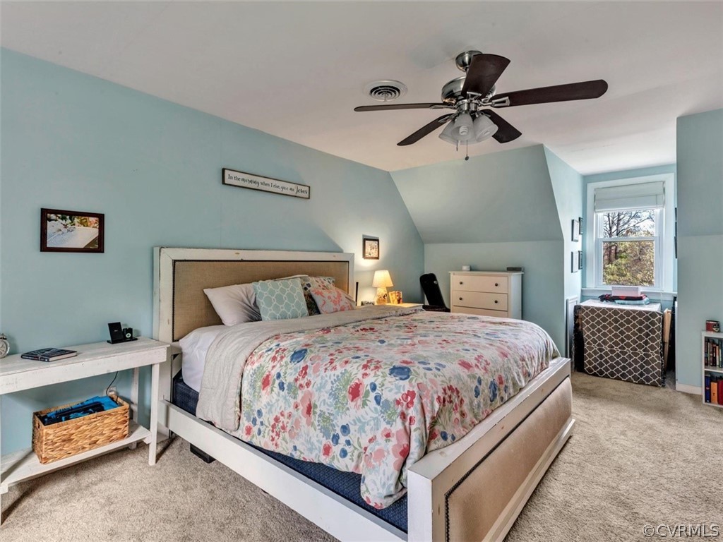 2606 Colgrave Road Midlothian, VA 23112 - Photo 16 of 22 a bedroom with a bed and a chandelier