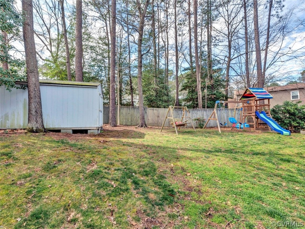 2606 Colgrave Road Midlothian, VA 23112 - Photo 20 of 22 a view of a backyard with a garden and entertaining space