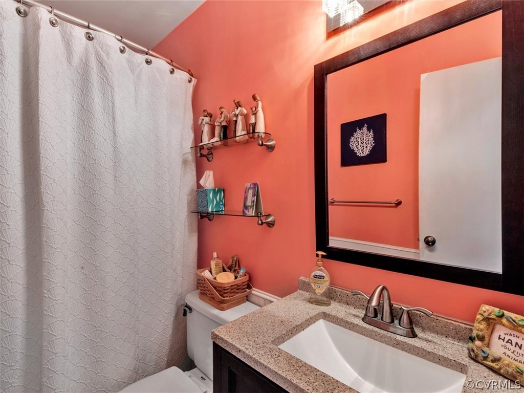 2606 Colgrave Road Midlothian, VA 23112 - Photo 10 of 22 a bathroom with a granite countertop sink and a mirror