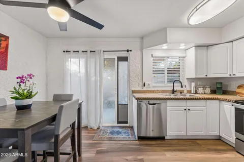 a kitchen with a table and chairs in it