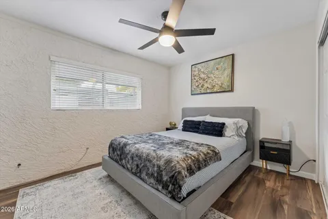 a bedroom with a bed and a table