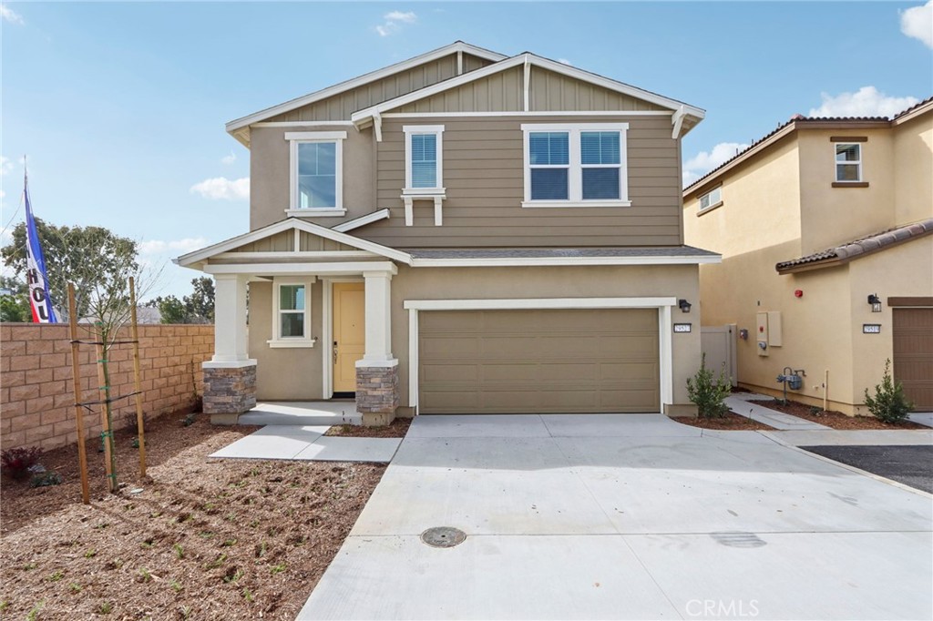 a front view of a house with yard