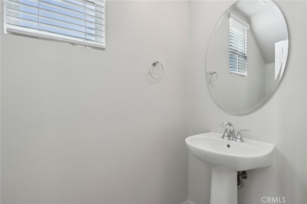 29527 Via Cosecha Temecula, CA 92591 - Photo 15 of 35 a bathroom with a sink and mirror