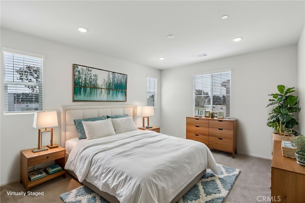 29527 Via Cosecha Temecula, CA 92591 - Photo 18 of 35 a bedroom with a bed and a potted plant