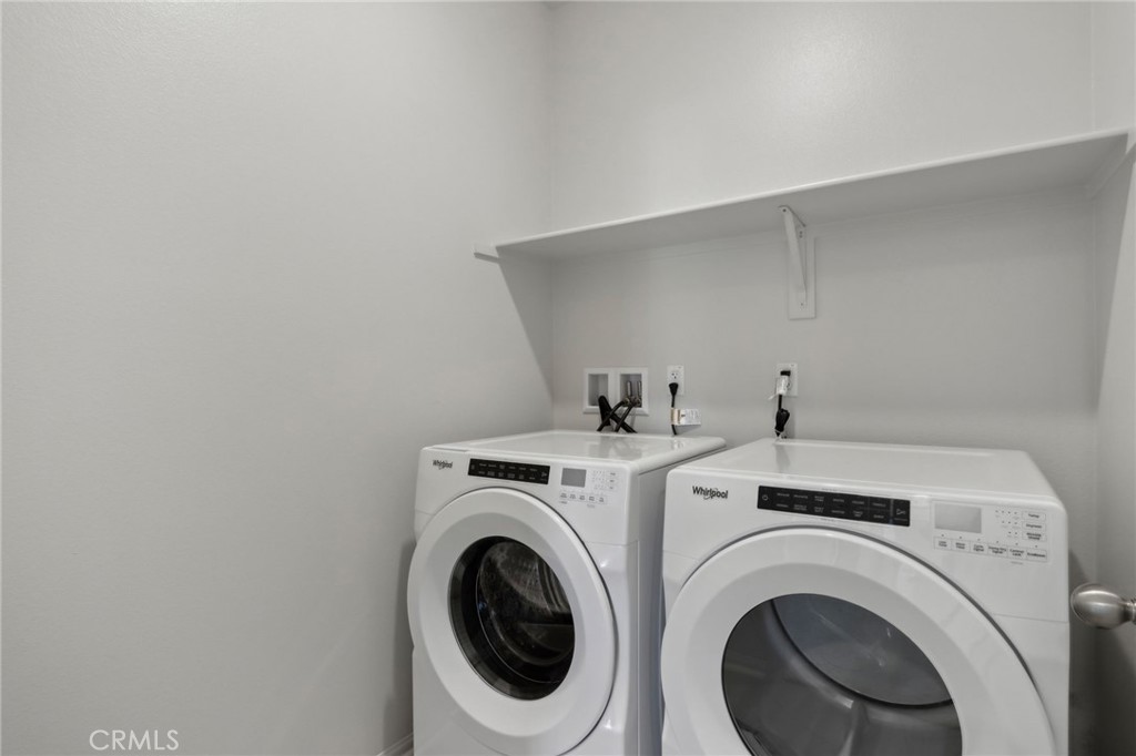 29527 Via Cosecha Temecula, CA 92591 - Photo 25 of 35 a utility room with dryer and washer