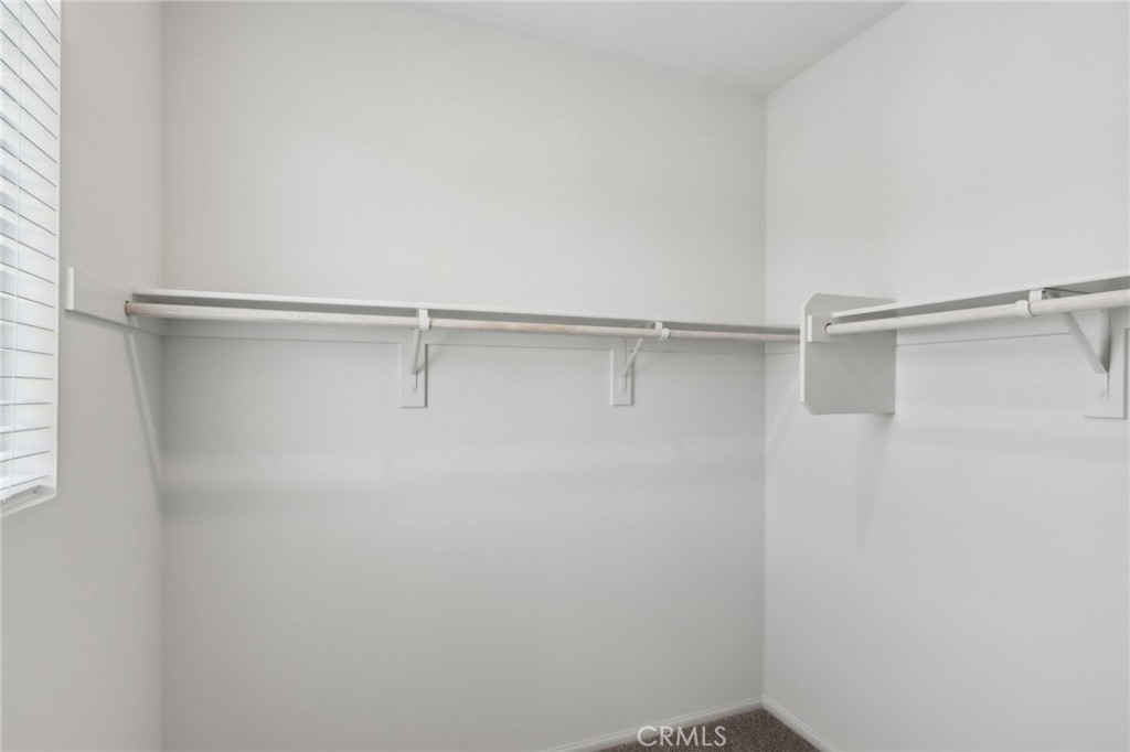 29527 Via Cosecha Temecula, CA 92591 - Photo 31 of 35 a view of a room with racks on the wall